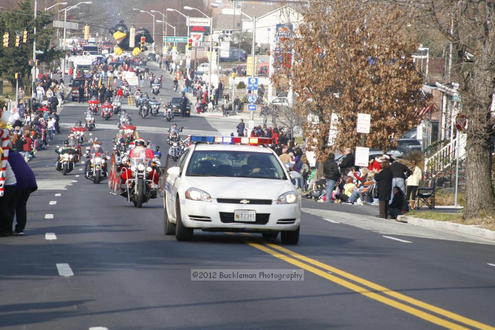 40th Annual Mayors Christmas Parade 2012\nPhotography by: Buckleman Photography\nall images ©2012 Buckleman Photography\nThe images displayed here are of low resolution;\nReprints available,  please contact us: \ngerard@bucklemanphotography.com\n410.608.7990\nbucklemanphotography.com\nFile Number - 2061.jpg