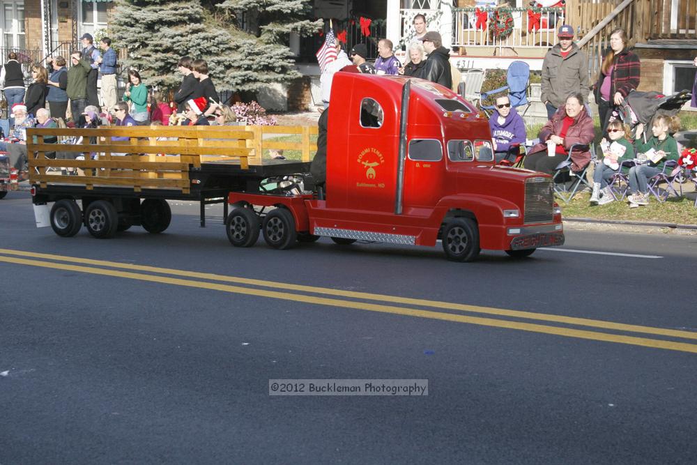 40th Annual Mayors Christmas Parade 2012\nPhotography by: Buckleman Photography\nall images ©2012 Buckleman Photography\nThe images displayed here are of low resolution;\nReprints available,  please contact us: \ngerard@bucklemanphotography.com\n410.608.7990\nbucklemanphotography.com\nFile Number 2406.jpg