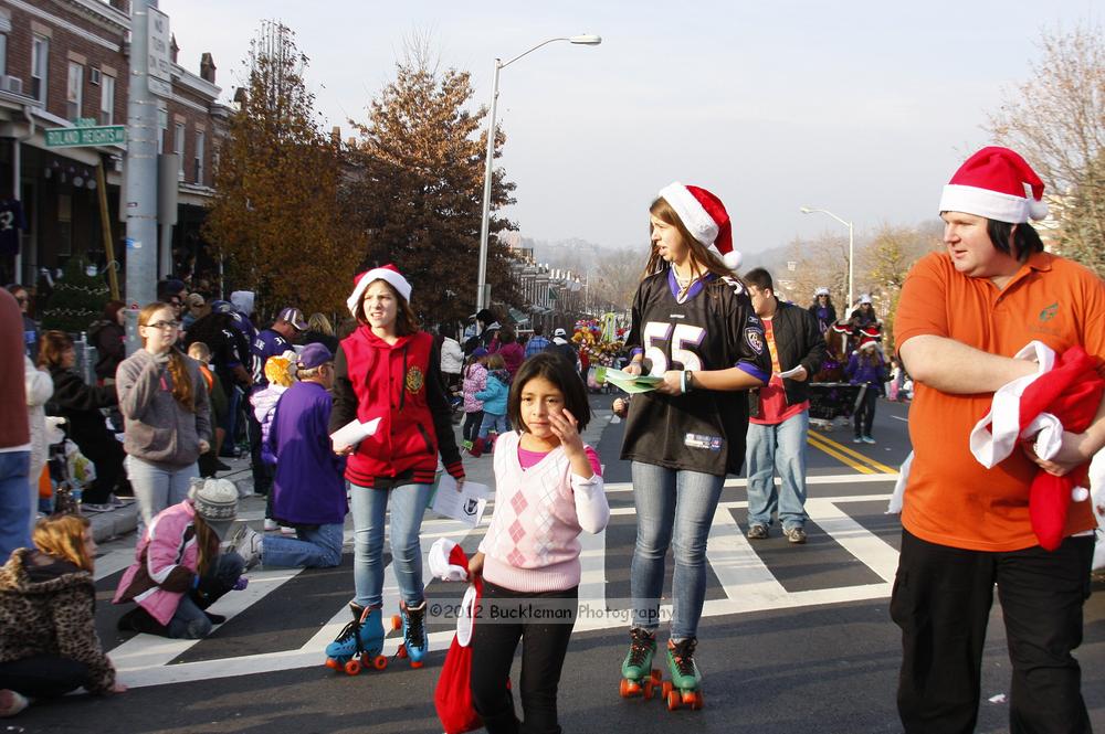 40th Annual Mayors Christmas Parade 2012\nPhotography by: Buckleman Photography\nall images ©2012 Buckleman Photography\nThe images displayed here are of low resolution;\nReprints available,  please contact us: \ngerard@bucklemanphotography.com\n410.608.7990\nbucklemanphotography.com\nFile Number 6000.jpg