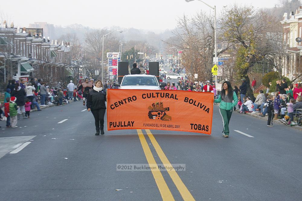 40th Annual Mayors Christmas Parade 2012\nPhotography by: Buckleman Photography\nall images ©2012 Buckleman Photography\nThe images displayed here are of low resolution;\nReprints available,  please contact us: \ngerard@bucklemanphotography.com\n410.608.7990\nbucklemanphotography.com\nFile Number 6027.jpg