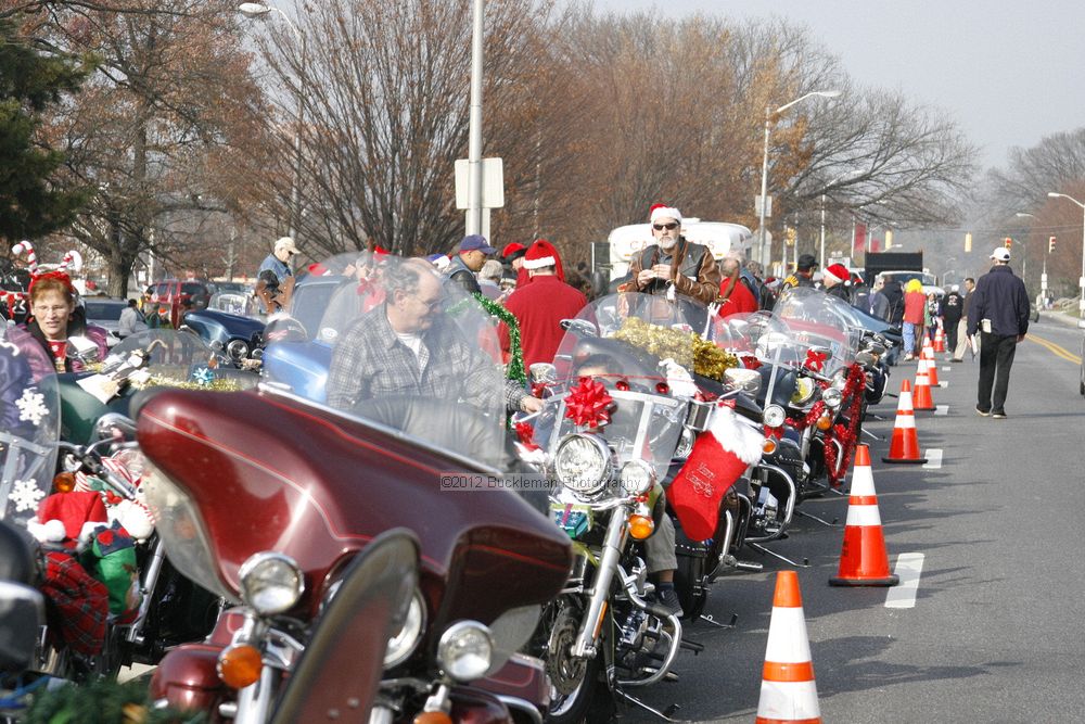 40th Annual Mayors Christmas Parade 2012\nPhotography by: Buckleman Photography\nall images ©2012 Buckleman Photography\nThe images displayed here are of low resolution;\nReprints available,  please contact us: \ngerard@bucklemanphotography.com\n410.608.7990\nbucklemanphotography.com\nFile Number 2052.jpg